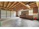 A spacious garage with a large door and built in shelving at 509 Hill St, Moncks Corner, SC 29461
