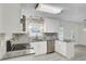 Well-appointed kitchen boasts granite countertops, stainless appliances, stylish backsplash, and ample cabinet space at 509 Hill St, Moncks Corner, SC 29461