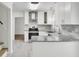 Modern kitchen featuring granite countertops, new stainless steel appliances, and gray backsplash at 509 Hill St, Moncks Corner, SC 29461