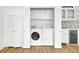 A laundry room with a full sized washer and dryer and closet doors for easy access at 509 Hill St, Moncks Corner, SC 29461