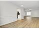 Spacious living area with wood flooring, seamlessly connects to the kitchen and dining area, ideal for gatherings at 509 Hill St, Moncks Corner, SC 29461