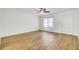 Bright living room featuring sleek wood floors, fresh paint, and a door at 509 Hill St, Moncks Corner, SC 29461