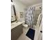 Functional bathroom with gray vanity, shiplap, and shower-tub combination at 640 Semaht St, Charleston, SC 29412