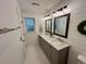 Stylish bathroom featuring shiplap walls, double vanity, and hexagon tile floor at 640 Semaht St, Charleston, SC 29412