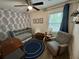 Charming Bedroom with blue wallpaper, crib, and a cozy armchair at 640 Semaht St, Charleston, SC 29412