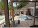 Backyard deck with a hot tub, surrounded by a wooden fence and lush trees at 805 Horne St, Saint George, SC 29477