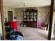 Dining room with ornate wallpaper, a chandelier, and a large china cabinet at 805 Horne St, Saint George, SC 29477