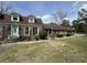 Charming brick home featuring dormer windows and a vibrant turquoise front door at 805 Horne St, Saint George, SC 29477
