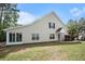 The home's exterior showcasing a sunroom, windows, front yard, landscaping, and great curb appeal at 8739 Grassy Oak Trl, North Charleston, SC 29420