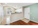 Open-concept kitchen with white cabinets, granite countertops, and stainless steel appliances at 8739 Grassy Oak Trl, North Charleston, SC 29420