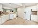 Clean kitchen offering lots of cabinets, granite countertops and stainless steel appliances at 8739 Grassy Oak Trl, North Charleston, SC 29420