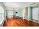 Spacious living room boasts hardwood floors, natural light, and an open floor plan at 8739 Grassy Oak Trl, North Charleston, SC 29420