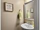 Stylish half bathroom featuring modern fixtures and humorous wall decor at 8810 Gilston Ln, North Charleston, SC 29420