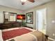 Bedroom with wooden furniture, neutral walls, ceiling fan, and mounted television for entertainment at 8810 Gilston Ln, North Charleston, SC 29420