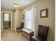 Well-lit hallway with chairs and storage bench, offering a welcoming transition space at 8810 Gilston Ln, North Charleston, SC 29420