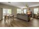 Spacious living room with hardwood floors, comfortable seating, and a sliding door to the deck at 8810 Gilston Ln, North Charleston, SC 29420