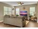 Cozy living room with comfortable sofa, stylish decor, and bright, airy windows at 8810 Gilston Ln, North Charleston, SC 29420