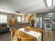 Open-concept living space with hardwood floors, a cozy living room, and a modern kitchen at 8810 Gilston Ln, North Charleston, SC 29420