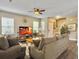 Comfortable living room with plush seating, a ceiling fan, and an entertainment center at 8810 Gilston Ln, North Charleston, SC 29420