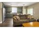 Open-concept living room with a view of the kitchen with stainless steel appliances at 8810 Gilston Ln, North Charleston, SC 29420
