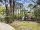 Community playground featuring climbing structures, slides, and a safe, cushioned surface for enjoyment at 8810 Gilston Ln, North Charleston, SC 29420