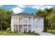 Charming two-story home with a covered front porch and second story balcony at 96 French Garden Cir, Summerville, SC 29486