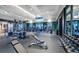 Bright community gym with green trim, large windows, ceiling fan, rubber floor, weight racks, and other exercise equipment at 96 French Garden Cir, Summerville, SC 29486
