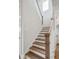 Staircase with wood treads and white risers leading to upper level rooms at 96 French Garden Cir, Summerville, SC 29486
