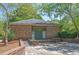 Community clubhouse featuring brick construction and a well-maintained exterior, nestled among mature trees at 104 Leighton Ct, Summerville, SC 29485