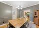 Cozy dining room showcases a rustic wooden table, modern lighting, and inviting decor at 104 Leighton Ct, Summerville, SC 29485