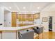 Traditional kitchen with bar seating, wood cabinets, and recessed lighting at 104 Leighton Ct, Summerville, SC 29485