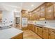 Kitchen features wood cabinets, stainless sink, microwave, oven, and smooth cooktop at 104 Leighton Ct, Summerville, SC 29485
