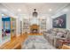 Cozy living room with a fireplace, plush seating, and built-in bookshelves for storage and display at 104 Leighton Ct, Summerville, SC 29485