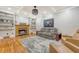 Inviting living room with hardwood floors, a decorative fireplace, and comfortable seating arrangement at 104 Leighton Ct, Summerville, SC 29485