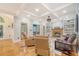 Comfortable living room with hardwood floors, a cozy fireplace, and coffered ceiling details at 104 Leighton Ct, Summerville, SC 29485