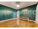 Bright office space featuring hardwood floors, natural light, and a stylish teal painted wall at 104 Leighton Ct, Summerville, SC 29485
