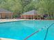 The sparkling community pool area features ample lounge seating and a convenient bath house at 104 Leighton Ct, Summerville, SC 29485