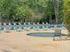 Relaxing pool area featuring lounge chairs and a hot tub at 104 Leighton Ct, Summerville, SC 29485