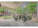Enclosed porch with comfortable seating, providing serene views of the lush backyard at 104 Leighton Ct, Summerville, SC 29485