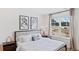 Bright bedroom featuring a large window, neutral decor, and modern art at 1040 Forrest Creek Dr, Summerville, SC 29483