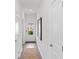 Bright hallway with neutral walls, doors and a view to the outdoors at 1040 Forrest Creek Dr, Summerville, SC 29483