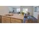 Kitchen island with granite countertops, stainless steel dishwasher with an open floor plan to the living and dining area at 1042 Forrest Creek Dr, Summerville, SC 29483