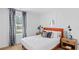 Cozy bedroom with a comfortable bed, stylish nightstands, and a window with patterned curtains at 1048 Forrest Creek Dr, Summerville, SC 29483