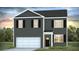 Two-story home featuring gray siding, black shutters, and an attached two-car garage, set against a sunset backdrop at 1048 Forrest Creek Dr, Summerville, SC 29483