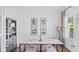 Stylish home office with a marble-topped desk, striped stools, and natural light streaming through the window at 1048 Forrest Creek Dr, Summerville, SC 29483