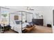 Spacious main bedroom with a four-poster bed, ceiling fan, and dark wood furnishings at 1048 Forrest Creek Dr, Summerville, SC 29483