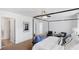 Large main bedroom with neutral tones, a four-poster bed, and an attached bathroom at 1048 Forrest Creek Dr, Summerville, SC 29483