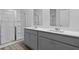 Modern bathroom with double vanity, quartz countertop, shower, and gray cabinets at 1052 Forrest Creek Dr, Summerville, SC 29483