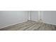 Bright bedroom with neutral gray walls and modern vinyl flooring, open doorways at 1052 Forrest Creek Dr, Summerville, SC 29483