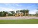 Community playground with natural wood equipment provides a fun, outdoor space for children to play at 1052 Forrest Creek Dr, Summerville, SC 29483
